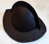 An Antique Comb Morian Helmet, the continental helmet is made of steel and has hand forged rivets.