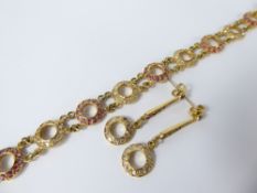 An 18 ct Diamond and Ruby Bracelet and Earrings.