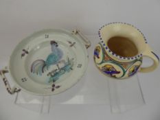 A Poole Pottery Jug, hand painted with blue and green pattern, together with a shallow twin