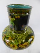 A Green and Yellow Porcelain Squat Baluster Vase in the Minton style, depicting vine leaves and