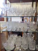 A Collection of Glass, including an Edinburgh Crystal miniature clock, two lidded decanters, two