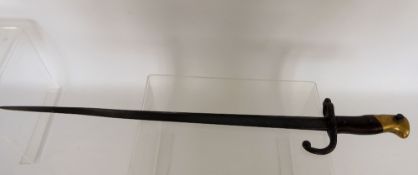 A 19th Century French Bayonet, brass and wood grip, triangular blade, approx 51 cms, no scabbard,