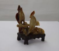 Two Hard Stone Chinese Carvings, one a vase with foliate decoration and the other birds seated on