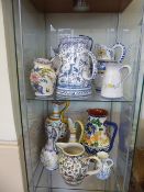 Twelve Portuguese Ceramic Jugs, of various sizes and styles, hand-painted in typical fashion.