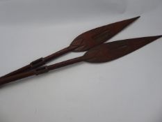 A Pair of Tribal Oceanic Wooden Paddles, with incised and pierced decoration, approx 93 cms. (af)