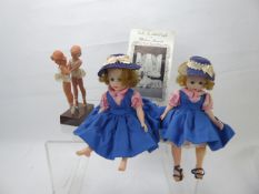 A Pair of American Dolls, by Madame Alexander, dressed in blue and pink outfits with navy blue straw