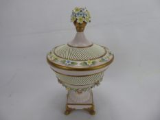 A 19th Century Capodimonte Comport and Cover, decorated with lattice-work and flowers in relief,