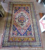 An Antique Woollen Carpet, approx 300 x 166 cms, the carpet of repetitive geometric and foliate