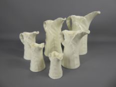 A Set of Six Cream Royal Worcester Graduated Jugs, of leaf design.