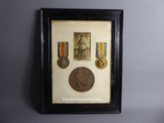 A Framed WWI Medal Group to Private Edward Savage and bronze death plaque reading 