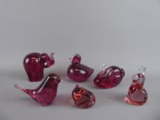 A Quantity of Wedgwood Cranberry Glass Animals, including an elephant, two rabbits, a frog, bird and