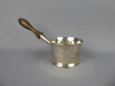 An Antique English Brandy Warmer, with turned handle, marks rubbed. Lion Passant just visible,