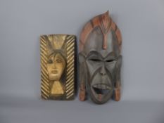 A West African Cameroon Tribal Mask, approx 40 cms, fearsome expression with stretched lobes