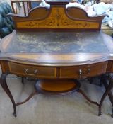 An Edwardian Desk, with a decoratively inlaid mantle and brown leather top above two drawers, on