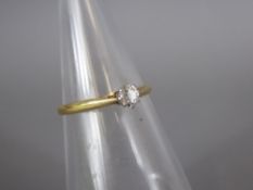 An 18ct Yellow Gold and Platinum Solitaire Diamond Ring, the dia approx 4.4 mm, size Q, approx 1.9