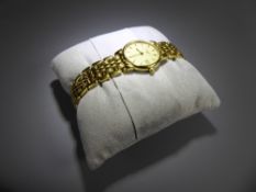 A Lady's Longines Stainless Steel Wrist Watch, the watching having a gold face with baton numerals