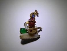 An 14-15ct Yellow Gold Sapphire, Ruby, Emerald, Pearl and Red Stone Indian Musician Brooch.