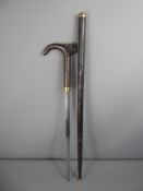 A Late 19th Century Sword Stick, the handle carved with a face.