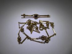 A 9ct Gold Bead-Link Necklace, together with a 9ct Garnet brooch, approx 560 mm, approx 10.9 gms.
