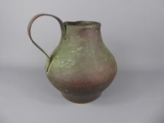 An Antique Egyptian Hammered Copper Water Jug, Islamic signature to neck, approx 20 cms, the jug