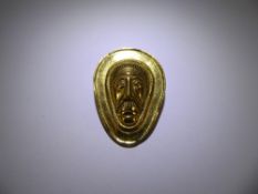 A Yellow Metal Aztec Style Brooch, mm NMKOP with crown above.