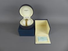 A Lady's 18k Gold Plated Raymond Wiel Wrist Watch, the watch having a black and white stone face,