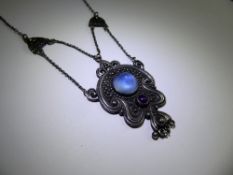 An Art Nouveau Liberty-Style Silver and Moonstone, moonstone approx 12 x 8 mm, amethyst 4 mm, the