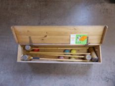 A Vintage 'Croquet Association' Set, two mallets and a set of balls, contained within a pine box and