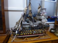 A Model of H.M.S. Victory, complete with sails and rigging, approx 92 x 32 cms (would benefit from