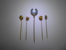 Six Antique Gentleman's Tie Sticks, including a 14/15 ct yellow gold and seed pearl tie stick, 14/15