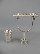 An Israeli Silver Menorah stamped 925, approx 94.8 gms., together with a silver beaker, approx 25.