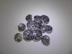 A Set of Twelve Silver Thistle Buttons, five large and seven small. London hallmark, dated 1900,