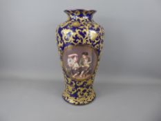 A Continental Porcelain Blue and Gilt Effect Portrait Vase depicting beggar boys eating grapes and