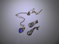 A 9ct Gold and Crystal Heart Shaped Pendant on 9 ct chain with a pair of 9 ct gold crystal drop