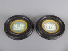 Two Wedgwood Porcelain Plaques, contained within ebony frames.