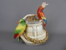 A Continental Basket, moulded with two parakeets, marks to base, approx 26 cms (wf) together with