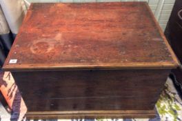 An oak trunk, 19th century of rectangular form with hinged lid above tongue and groove joined