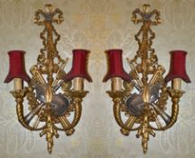 A pair of gilt wood Chippendale style twin branch wall sconces the wall mount with pierced ribbon
