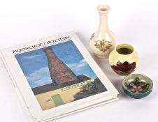 A William Moorcroft Anemone pattern tube lined squat vase, 20th century in yellow ground, together