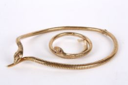 A gold articulated Victorian style snake necklace and matching bangle marked for 9ct gold and with