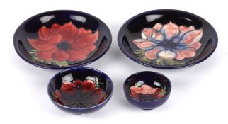 A pair of William Moorcroft Anemone pattern tube lined dishes, 20th century, of circular dished form