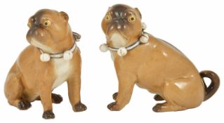 A pair of porcelain Pug Dogs, 19th century each in a seated position, with tan and brown coats, with