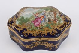 A Svres porcelain casket, 20th century of shaped form with hinged cover painted with central