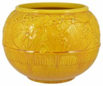 A Burmantoft's faience bowl, early 20th century of circular form with floral embossed decoration