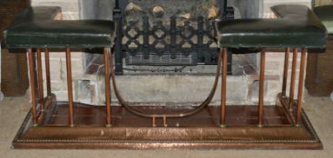 A copper and upholstered fire fender, early 20th century of typical form with upholstered leather