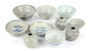 A collection of Chinese blue and white Swatow ceramics, late Ming to include two raddish painted