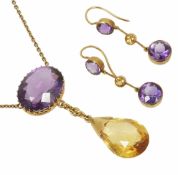 An attractive amethyst and yellow gem drop pendant necklace and earrings with central, side set