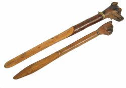 Two dog mounted treen paper knives the first with carved head of a pug, the other with carved head