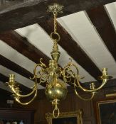 Dutch style brass six branch candle chandelier, early 20th century the central tapering baluster