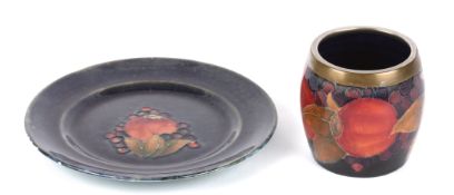 A William Moorcroft tube lined Pomegranate pattern plate, 20th century of small circular proportions